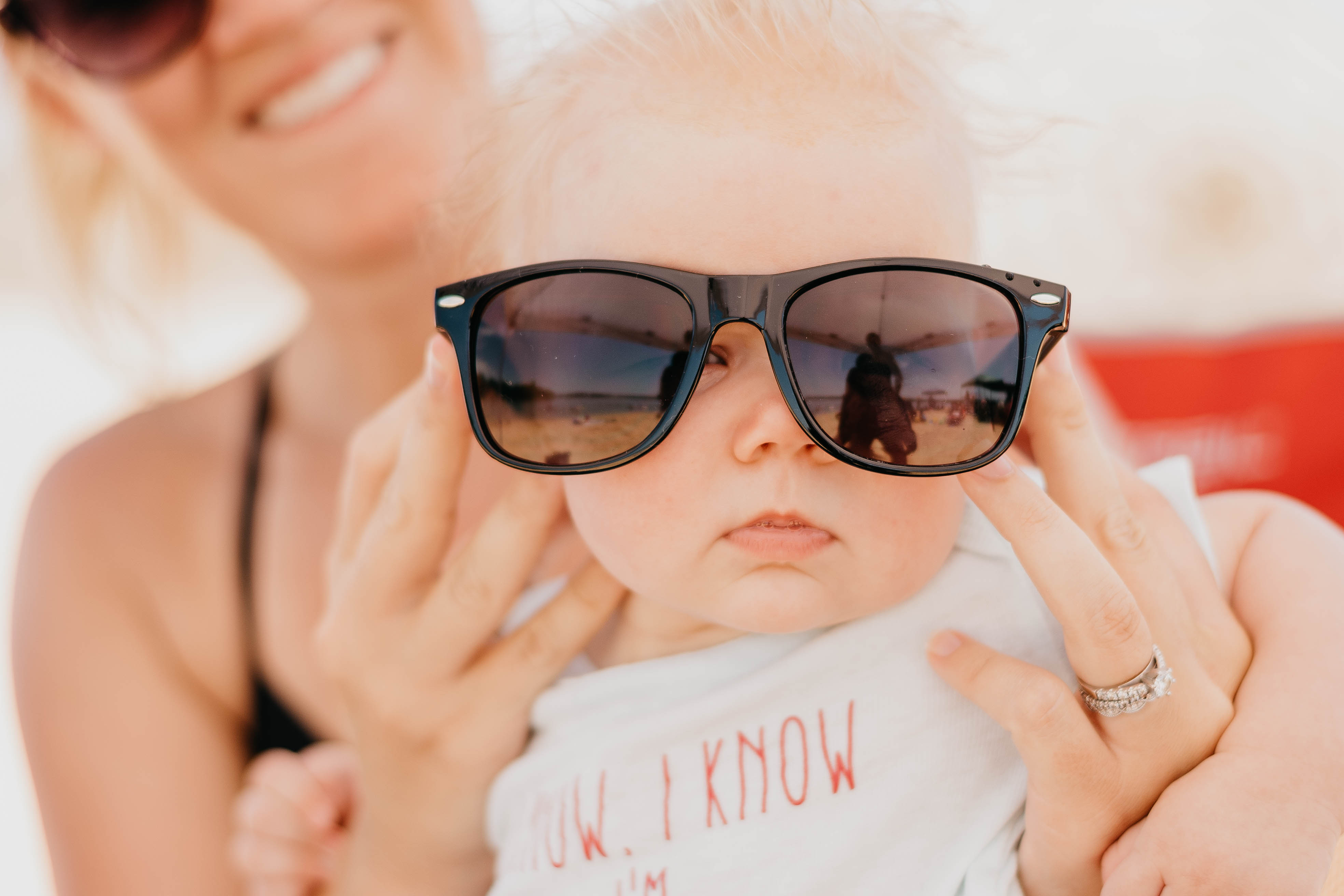 Baby at Little Elm Beach with sunglasses on his head