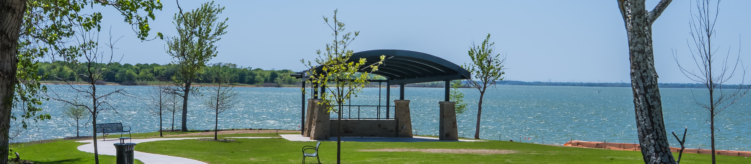 Cottonwood Park renovated pavilion with grass and lake view