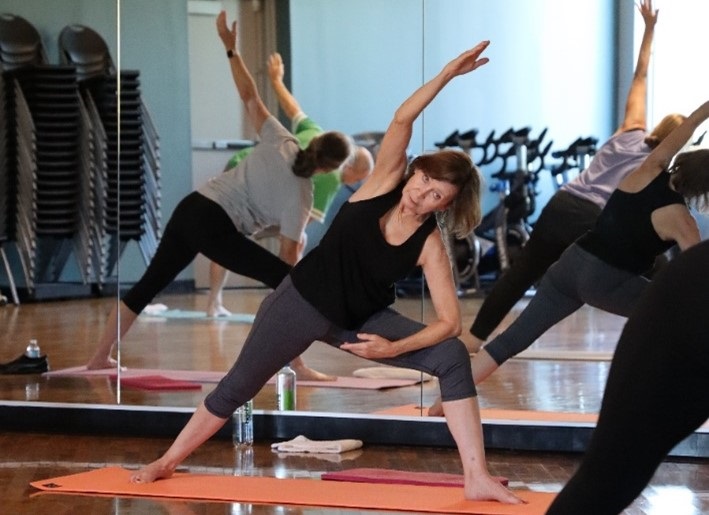 Woman performing yoga in a studio